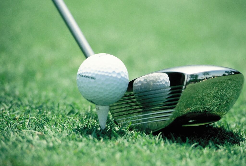 A perfectly timed reflection captured in a polished golf club head