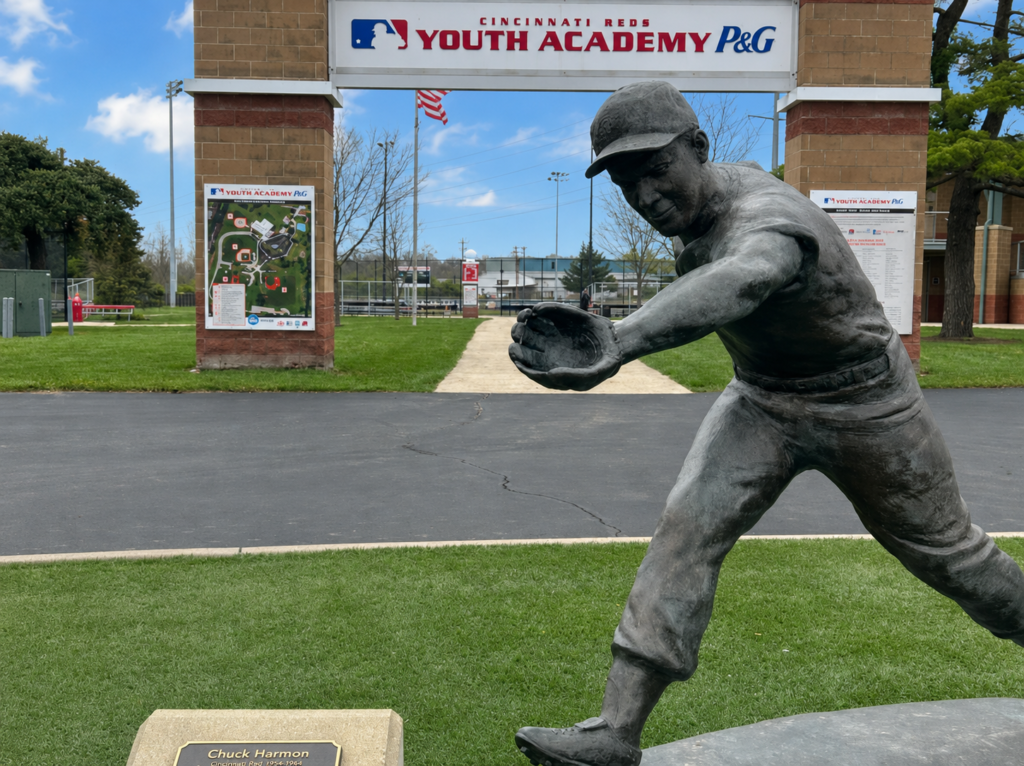 Sculptor Tom Tsuchiya’s bronze statue The Glove honors Chuck Harmon, the first African American player in Cincinnati Reds history, outside the Youth Academy in Cincinnati’s Roselawn neighborhood.