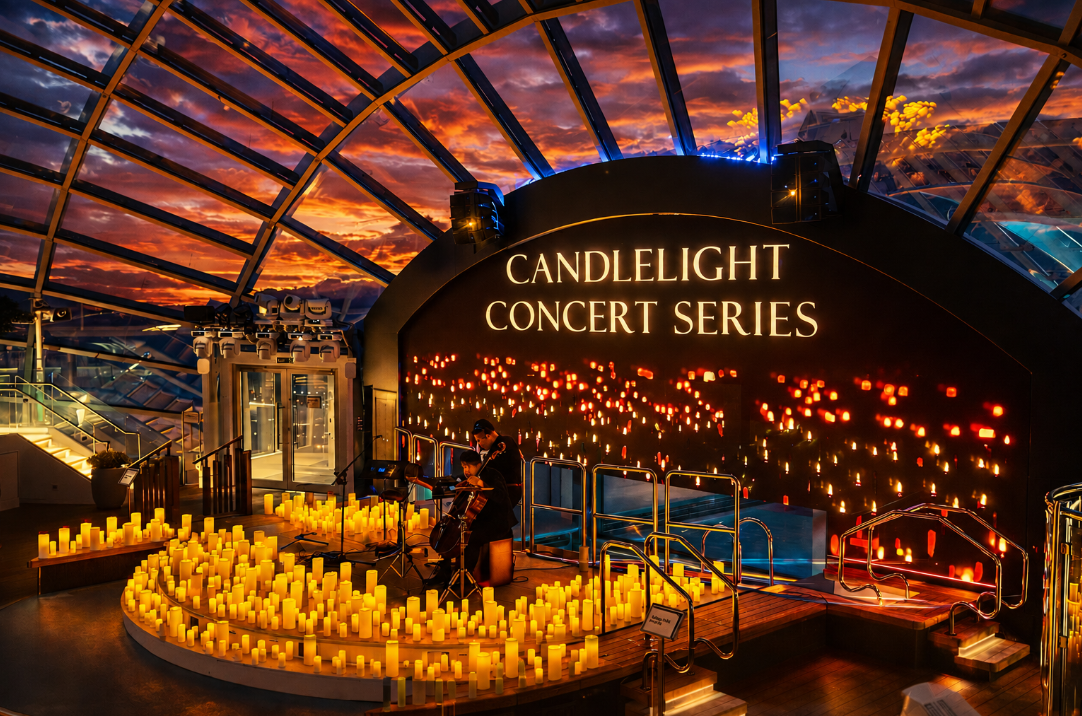 Candlelight concert aboard Icon of the Seas beneath a glass dome at sunset