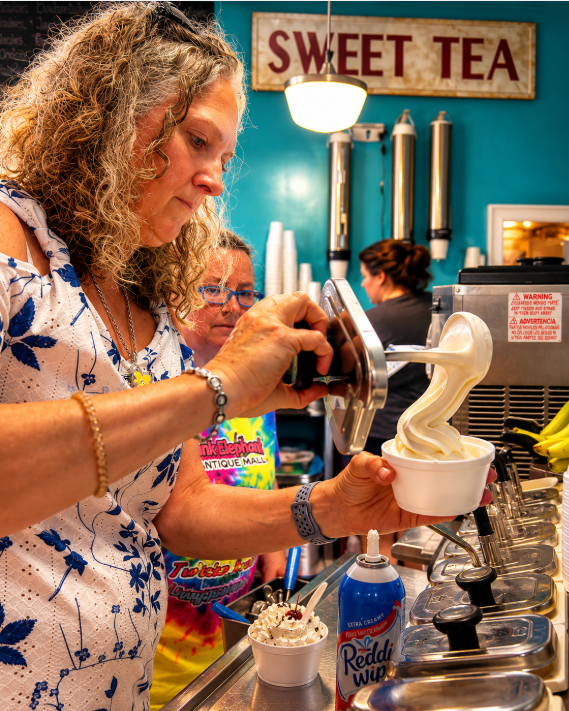 Tania making sundae at Pink Elephant Antique Mall in Livingston Illinois on Route 66