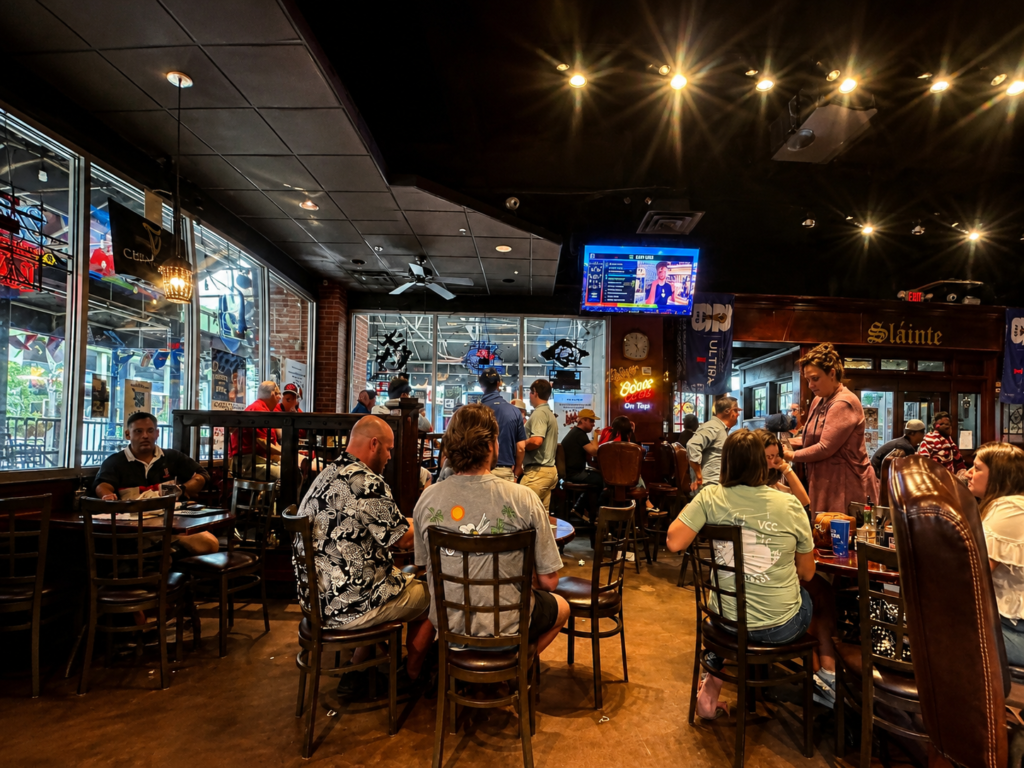 Guests fill the dining room at Dugan's Pub in Wichita, Kansas, watching a FIFA World Cup match and creating a lively Irish pub atmosphere.