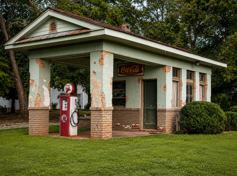 Historic roadside service station with a vintage Texaco Fire-Chief gas pump and Coca-Cola sign in Watkinsville, Georgia.
