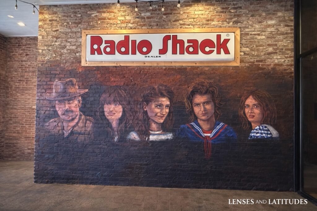 Stranger Things character mural beneath a RadioShack sign in Jackson, Georgia