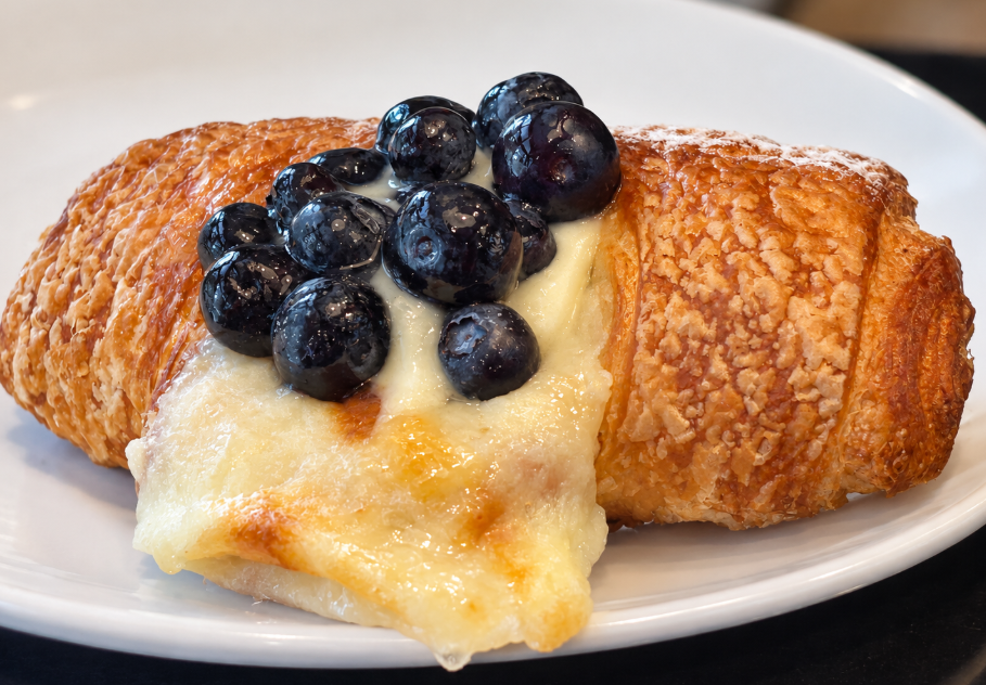 Blueberry-topped French pastry with crisp golden layers at The Patisserie on Main