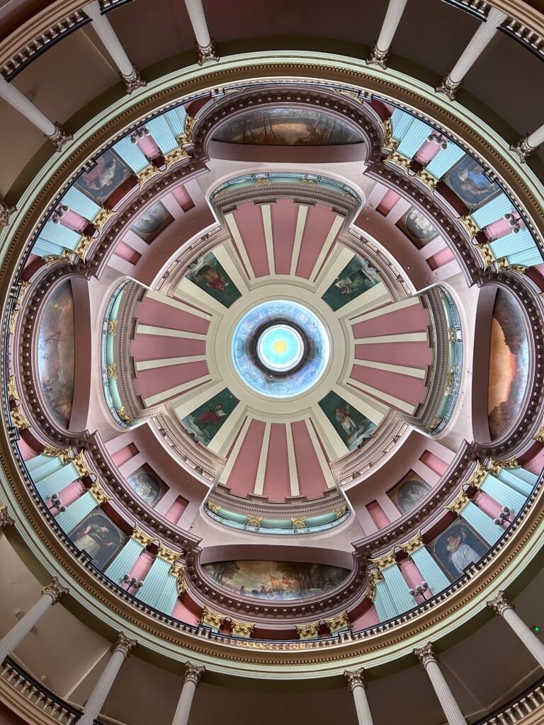 Ornate rotunda ceiling with murals, columns and circular balconies inside the Old Courthouse in St. Louis