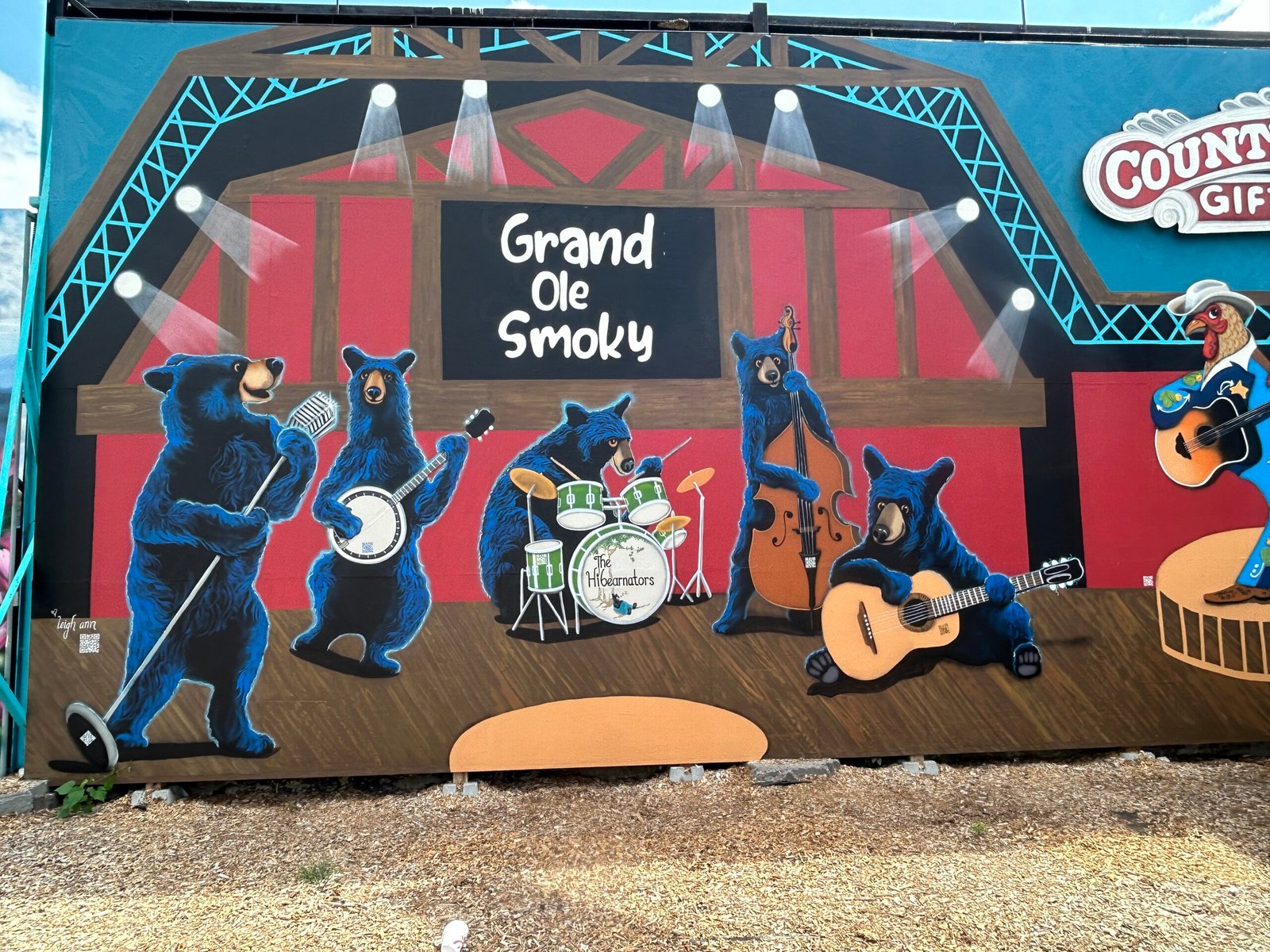 Colorful mural of black bears playing country music on the Grand Ole Smoky stage at Bigfoot’s Country Barn in Pigeon Forge.