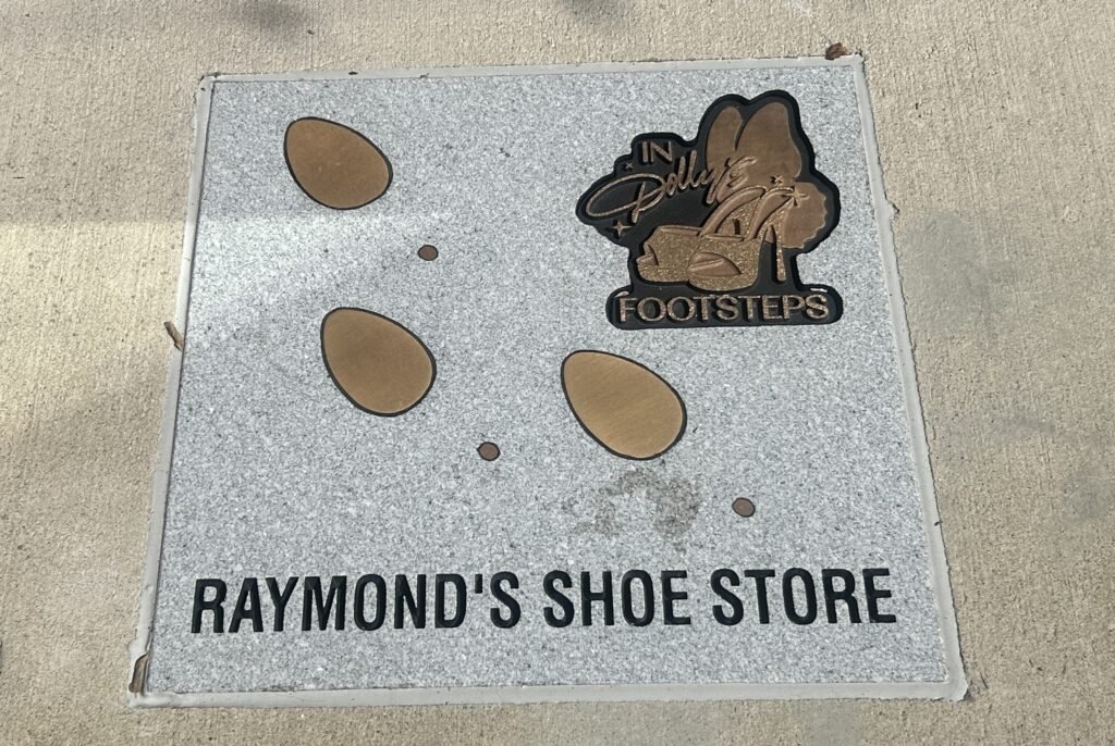 Raymond’s Shoe Store sidewalk marker on the In Dolly’s Footsteps walking tour in downtown Sevierville