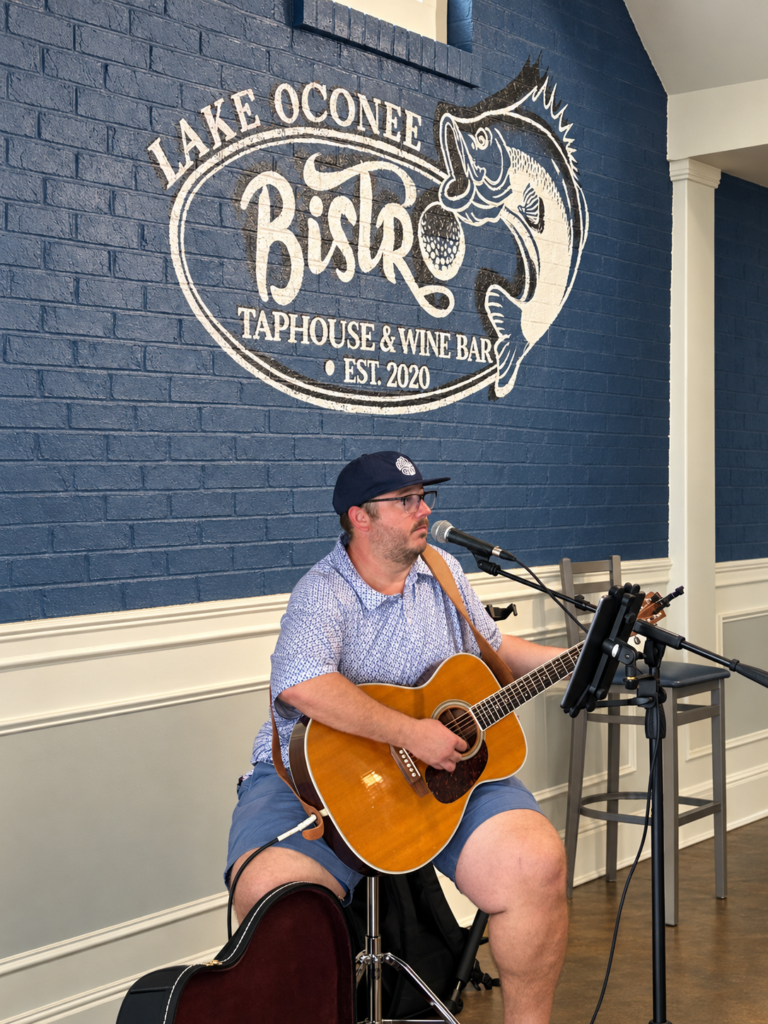 Guitarist performing live music inside Lake Oconee Bistro in Eatonton, Georgia
