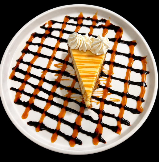 New York-style cheesecake with whipped cream, caramel and chocolate drizzle at Italian Chophouse on Lake Oconee