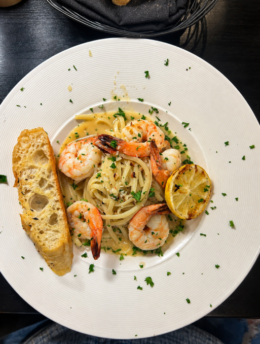 Shrimp scampi with jumbo shrimp, linguine, grilled lemon and bread at Italian Chophouse on Lake Oconee