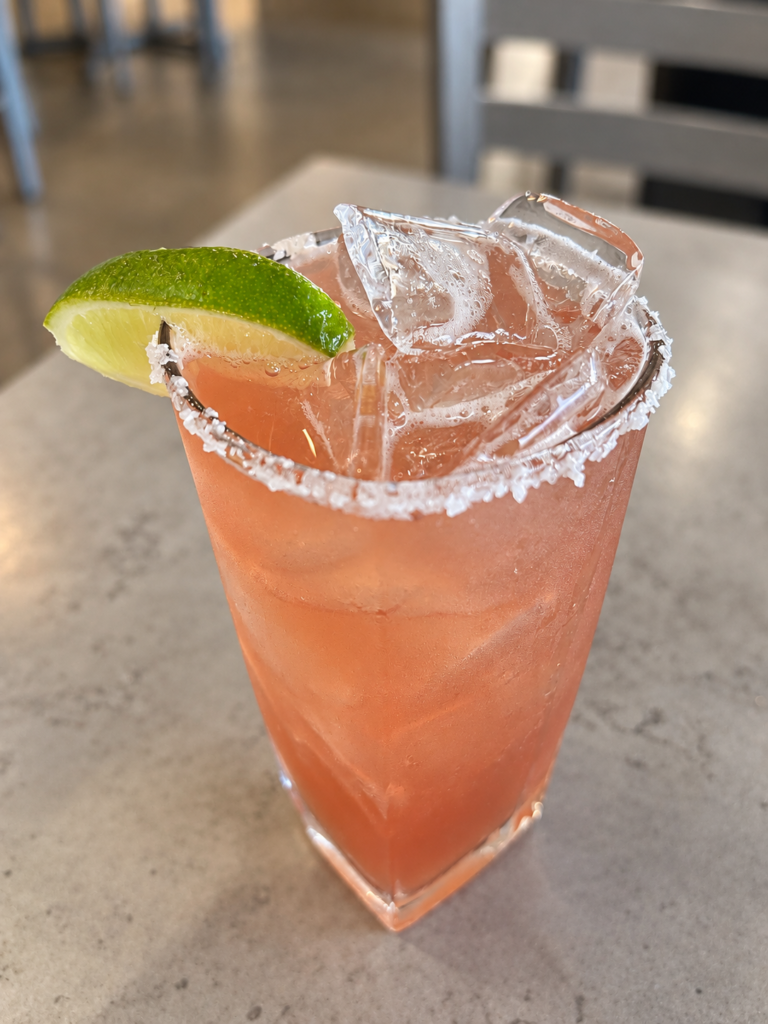 Strawberry basil margarita with a salted rim and fresh lime wedge at Lake Oconee Bistro