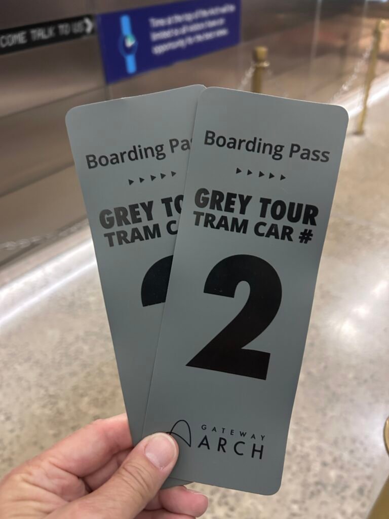 Two gray boarding passes for tram car number two at the Gateway Arch in St. Louis