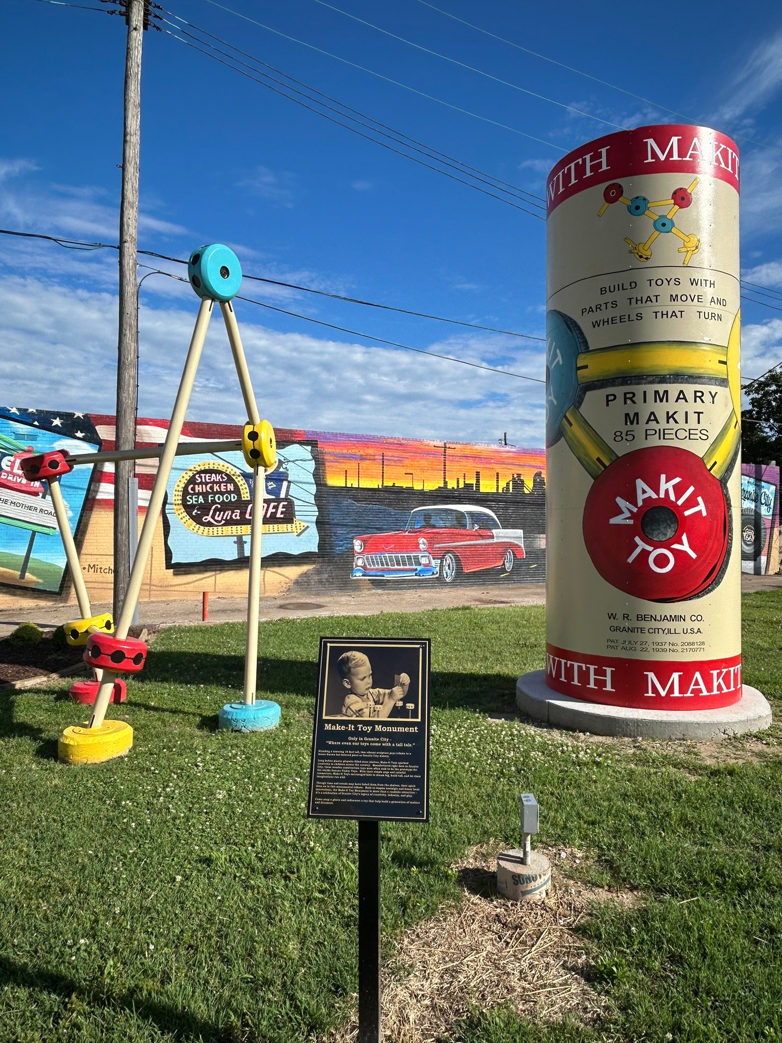 Giant Make-It Toy Monument in Granite City, Illinois, featuring a tall toy container and oversized colorful construction pieces