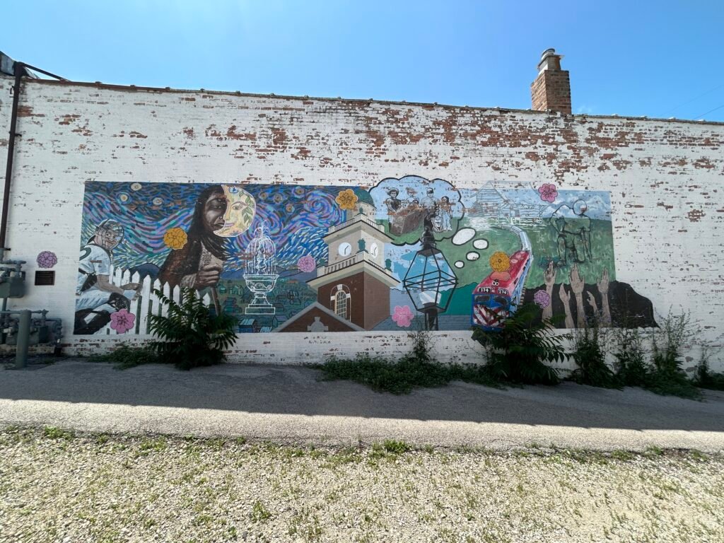It's About Time mural in downtown Glen Ellyn Illinois featuring local history, architecture and a commuter train